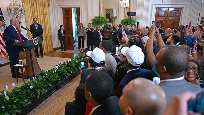 Scott was at the back of the room when Trump spoke alongside Woods. Picture: Jim Watson / AFP