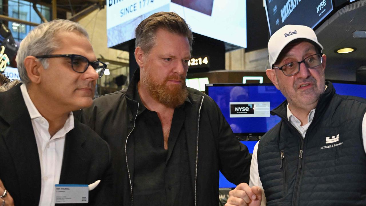 Birkenstock CEO Oliver Reichert (centre) on the trading floor at the New York Stock Exchange this week. Picture: AFP