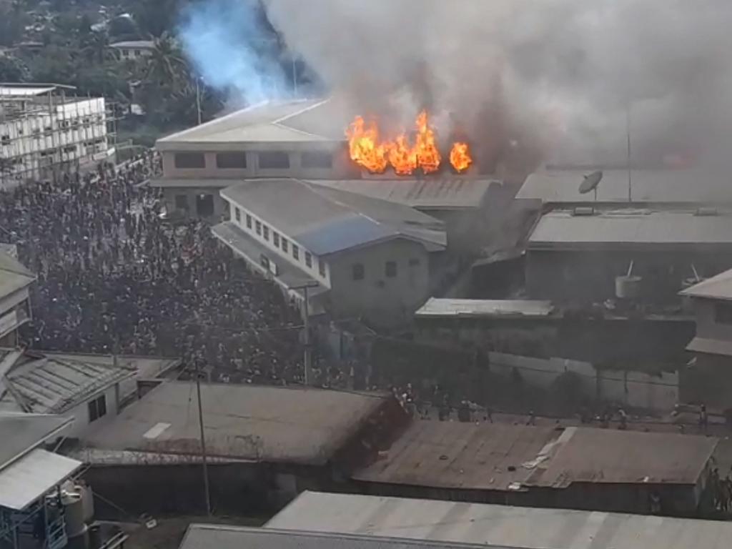 Parts of the Chinatown district on fire in Honiara on Solomon Islands, as rioters torched buildings in the capital in a second day of anti-government protests. Picture: JOB RONGO'AU FUOO / ZFM Radio / AFP