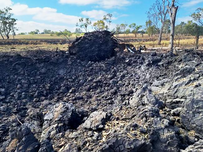 The crater on the Bruce Highway following the chemical explosion. Picture: TMR