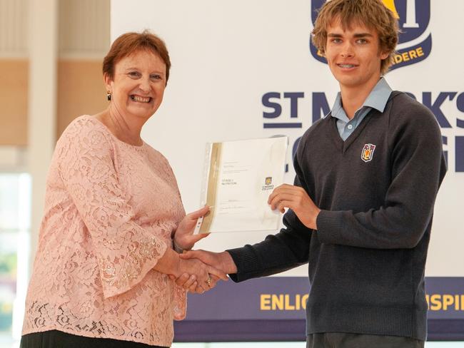 Ryan Finlay being presented his college dux award by St Mark's College Principal Sandra Hewson. Picture: supplied