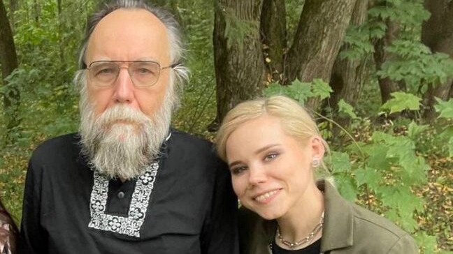 Russian resistance groups were linked to a car bombing that killed Daria Dugina, right, seen here with her ultra-nationalist father Aleksander Dugin.