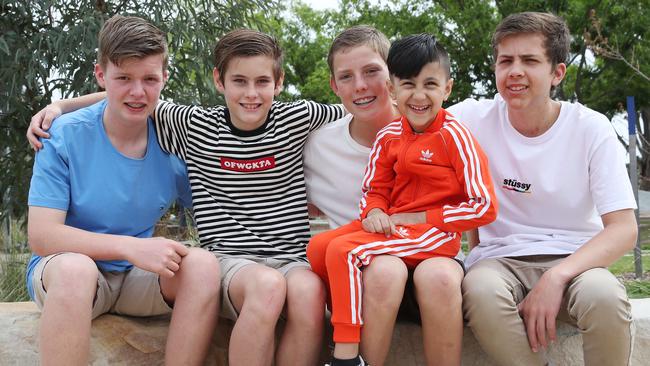 Four kids who performed CPR on a young boy who drowned in a pool last year have been reunited with him today. Pictuerd (left) is Jaime Privett, 14, Patrick Whitehouse, 12, Adam Al Kayal, 5, Zac Brown and Ben Whitehouse. Picture: David Swift.