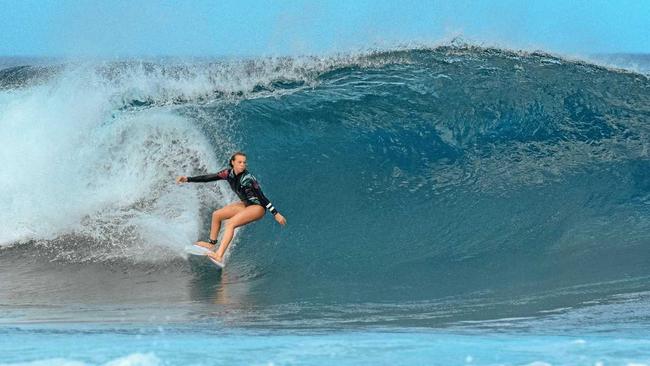 Noosa 13-year-old Amarnie Barber shredding a monster at Waimea Bay in Hawaii. Picture: Craig Barber