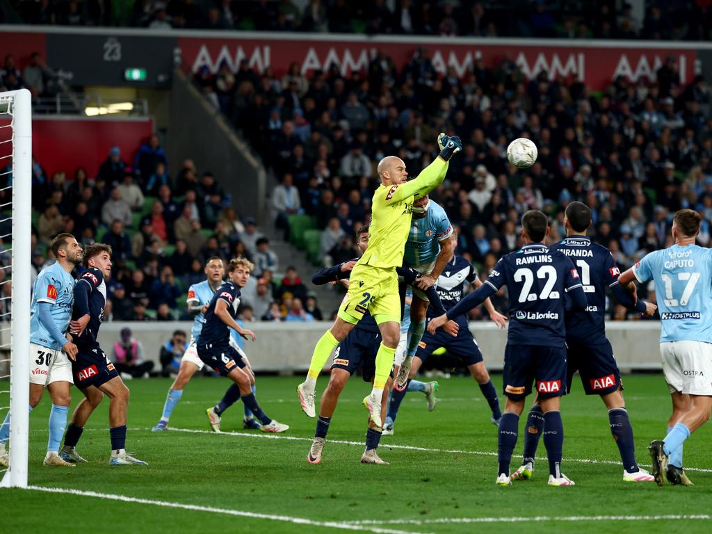 Jack Duncan (centre) punches a ball to safety during the A-League grand final. Picture: Morgan Hancock/Getty Images)