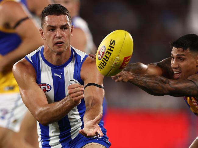 MELBOURNE . 18/03/2023.  AFL Round 1.  North Melbourne vs West Coast Eagles at Marvel Stadium.   Luke Davies-Uniacke of the Kangaroos clears by hand during the 1st qtr.   . Pic: Michael Klein