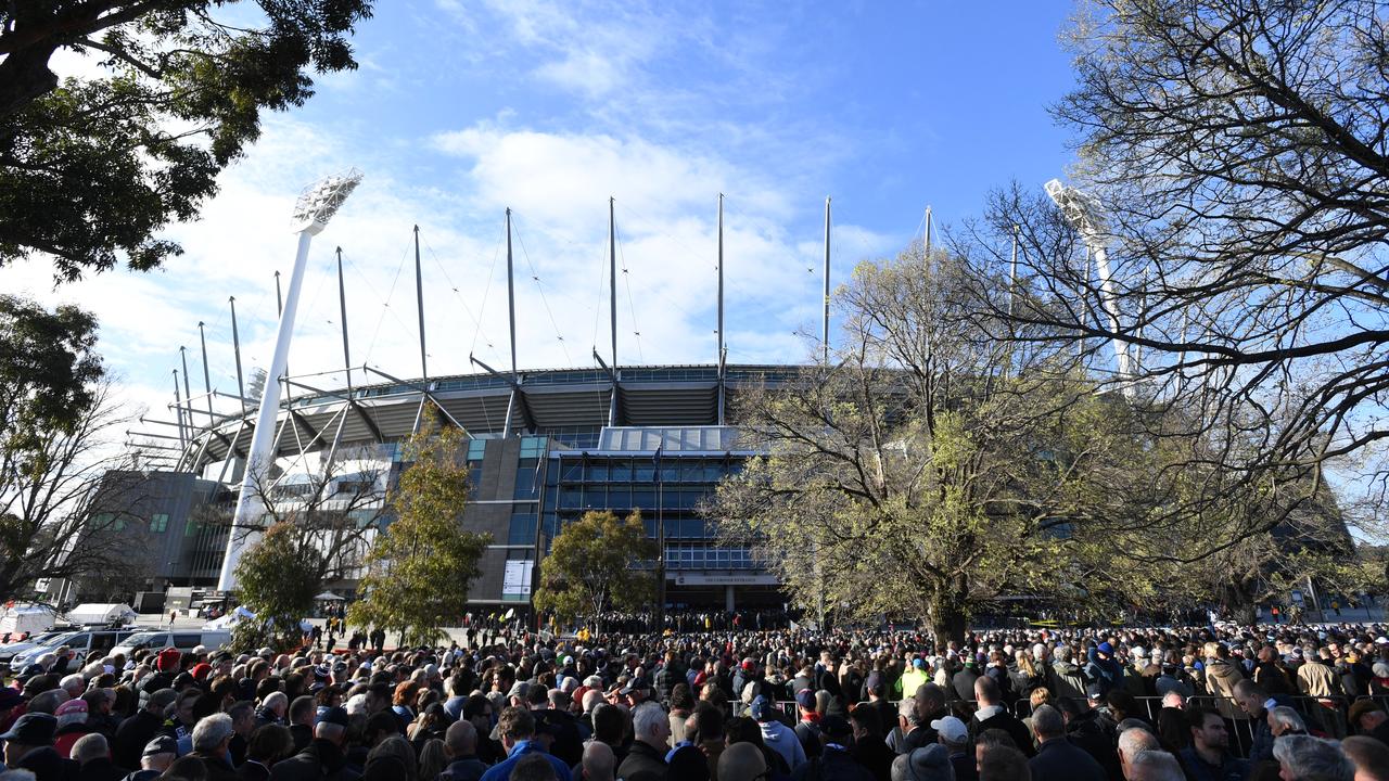 Attendees of a high-priced MCG function were seen fainting in a food poisoning scare before the Anzac Day clash. (AAP Image/Julian Smith)
