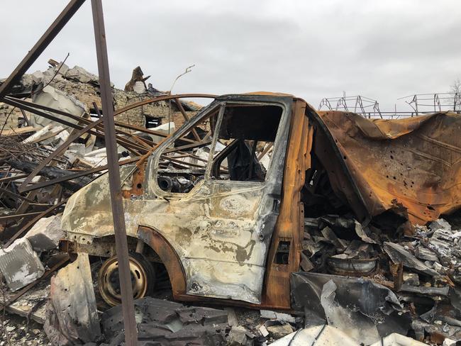 Destroyed cars stacked up on the outskirts of Irpin. April, 2022.