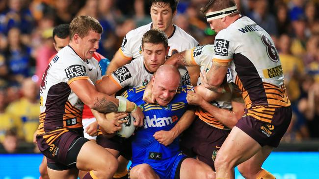 Beau Scott of the Eels tackled during the Parramatta Eels v Brisbane Broncos NRL round 1 game at Pirtek Stadium, Parramatta. pic Mark Evans