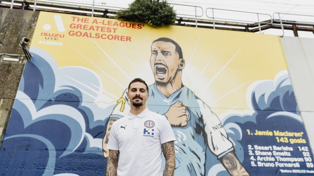 Jamie Maclaren likes the look of a mural celebrating his goalscoring achievements. Picture: Supplied