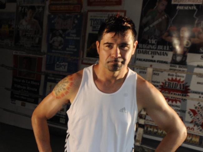 New Australian boxing champion Michael Perry gets a workout with Marc Bargero at his Wyongah gym.