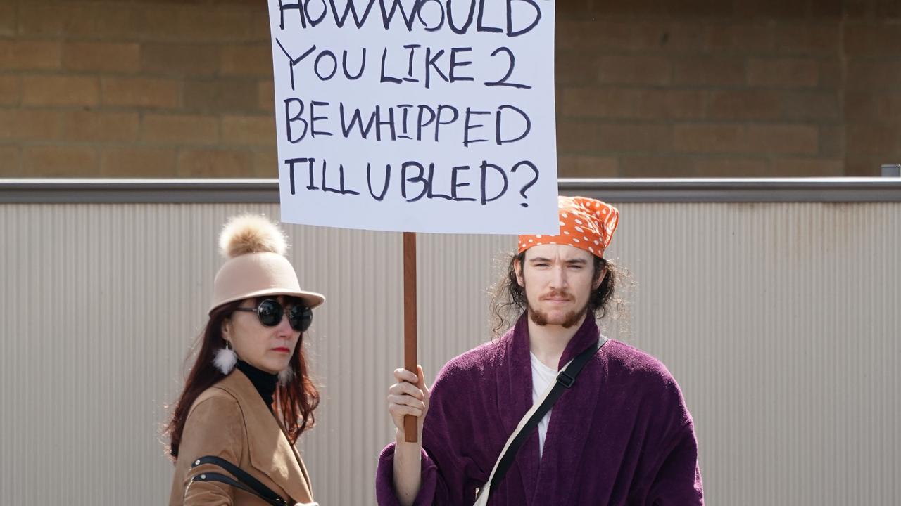 Perry McShane protesting at the Melbourne Cup outside of Flemington. Picture: AAP