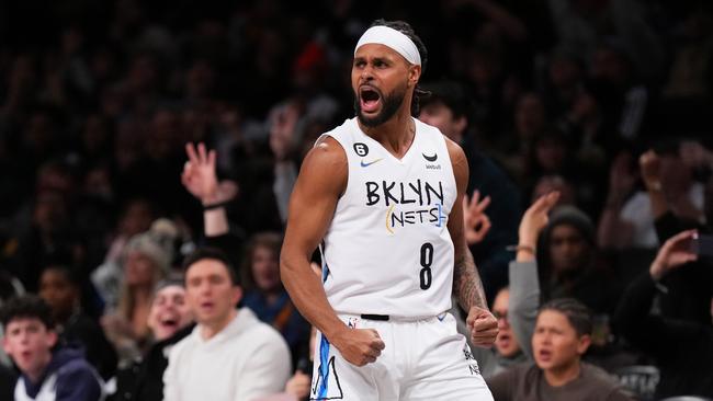 Patty Mills #8 of the Brooklyn Nets celebrates after hitting a three pointer during the second half against the Washington Wizards. (Photo by Mike Stobe/Getty Images)