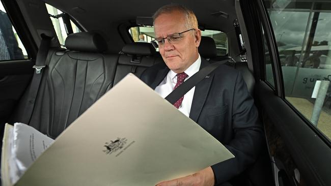 Scott Morrison has a rare quiet moment in his official car following his interview with The Australian in Brisbane on Monday. Picture: Lyndon Mechielsen