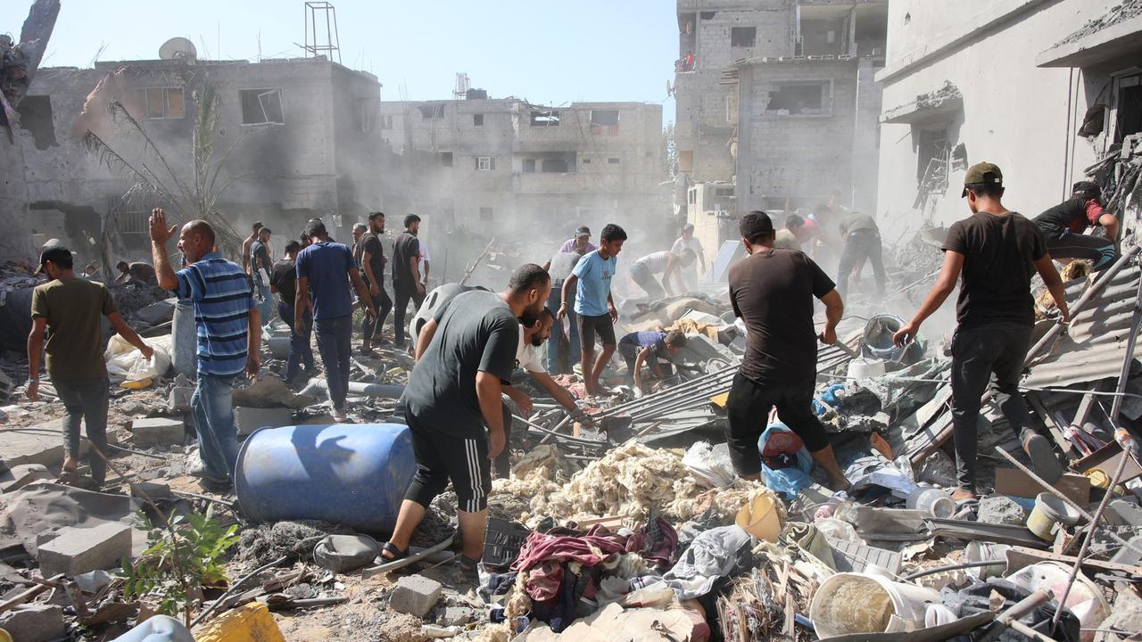 Palestinians search in the rubble for survivors at the site of an Israeli strike in the Shejaiya suburb east of Gaza City on September 12. Picture: AFP