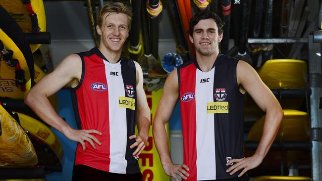 St Kilda draftees Hugh Goddard and Paddy McCartin show off their new jumpers at the Kurrawa Beach Surf Life Saving Club on the Gold Coast.