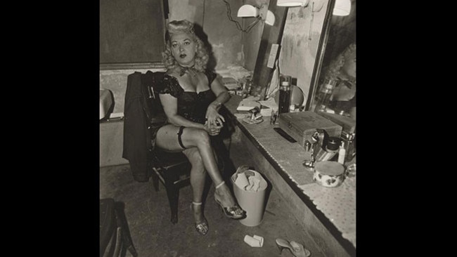 Burlesque comedienne in her dressing room, Atlantic City, NJ (1963) by Diane Arbus.