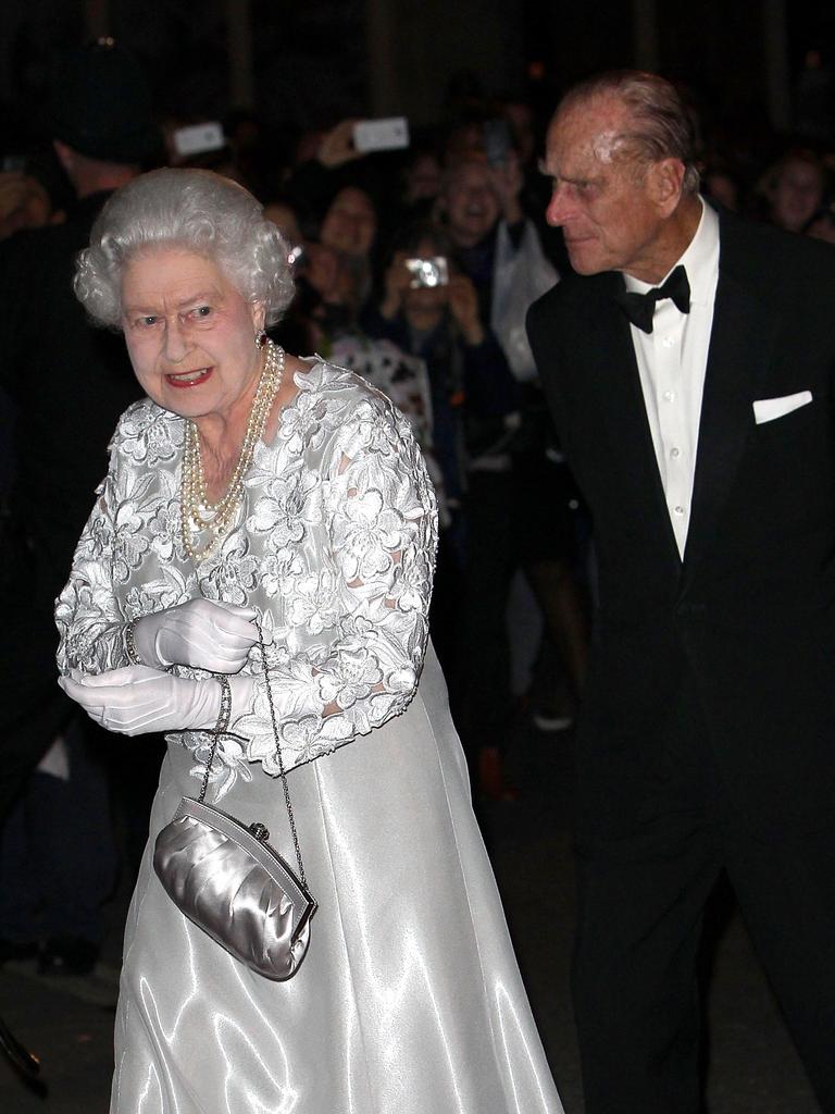 The Queen and Prince Philip attend a gala performance of 'Our Extraordinary World' in 2021. The handbag never far, even for her husband. Picture: Getty Images