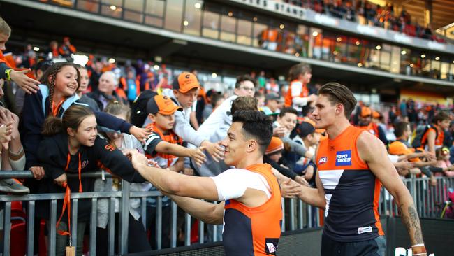 Dylan Shiel and Rory Lobb celebrate a win at Spotless Stadium.