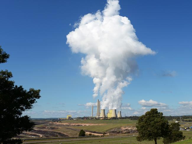 Steam billows from the cooling towers of the Loy Yang coal-fired power station operated by AGL Energy Ltd. in the Latrobe Valley, Australia, on Wednesday, April 29, 2015. The Australian government awarded 107 carbon-abatement contracts to mark the start of its A$2.55 billion ($2 billion) Emissions Reduction Fund to cut greenhouse-gas emissions. Photographer: Carla Gottgens/Bloomberg via Getty Images