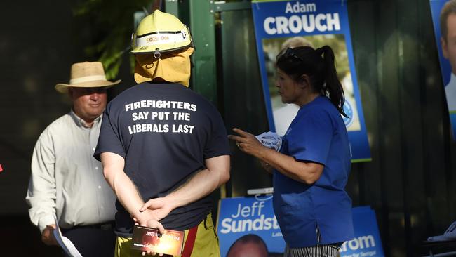Central Coast Election. NSW Fire and Rescue fireman handing out what appears to be election material at Erina High School in breach of department protocol. .pic Sue Graham