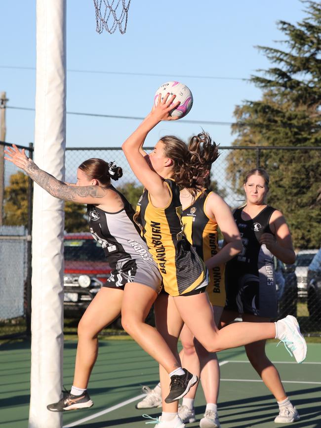 Bannockburn's Charlotte Scanlon makes a goal saving grab from incoming Marney McRandall of North Geelong. GDFNL North Geelong v Bannockburn netball. Picture: Alan Barber