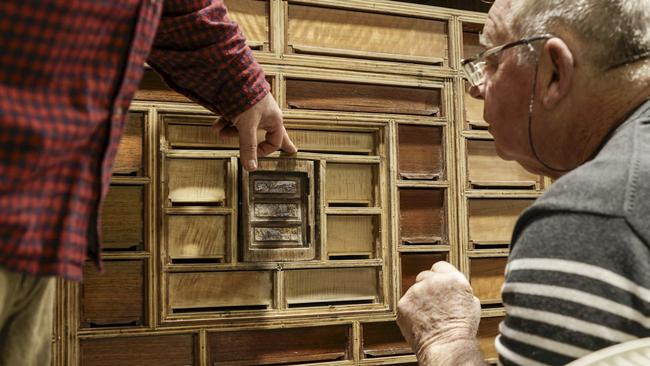 Creator Geoff Hannah visiting the Cabinet in the care of Greg Peters at Patinations in Canberra, during the Hannah Cabinet's recovery in 2023. Picture Brian Henry