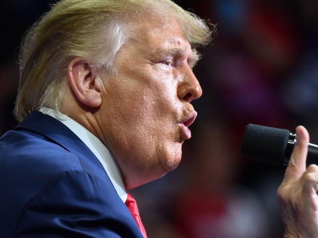 US President Donald Trump speaks during a campaign rally at the BOK Center on June 20, 2020 in Tulsa, Oklahoma. - Hundreds of supporters lined up early for Donald Trump's first political rally in months, saying the risk of contracting COVID-19 in a big, packed arena would not keep them from hearing the president's campaign message. (Photo by Nicholas Kamm / AFP)