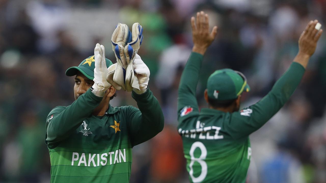 Pakistan celebrate the win. Photo: Alastair Grant/AP Photo.