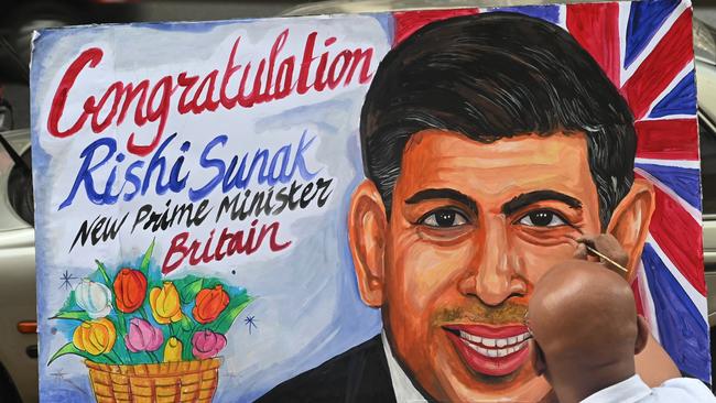 Art school teacher Sagar Kambli paints a picture of Sunak as a congratulatory celebration in Mumbai, India.