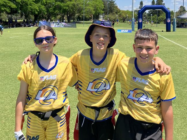 Mother Teresa Catholic Primary School students Celeste Franz-Hoobin, Quincy Carter and Tahlen Bradley at the 2024 U12 flag football national championships on the Gold Coast. Picture: Mitch Bourke.