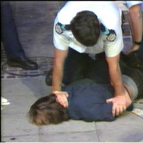 1998 Police allegedly grinding a man's face into a concrete pavement