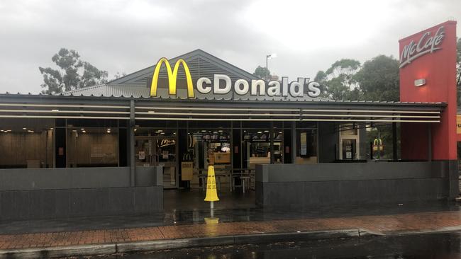 An aggressive woman allegedly spat on a teenage worked at Eagle Vale McDonalds.