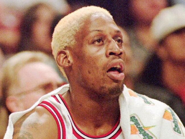 Chicago Bulls' Michael Jordan, left, and Dennis Rodman rest on the bench as they watch their teammates play the Washington Bullets during the first quarter Tuesday night, Oct. 17, 1995, in Chicago. (AP Photo/Fred Jewell). Basketball