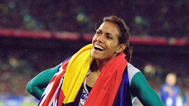 25 Sep 2000:  Cathy Freeman of Australia celebrates gold in the Womens 400m Final at the Olympic Stadium on Day Ten of the Sydney 2000 Olympic Games in Sydney, Australia. \\ Mandatory Credit: Nick Wilson /Allsport