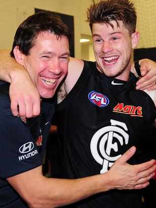 Brett Ratten and a young Bryce Gibbs after a Carlton win.