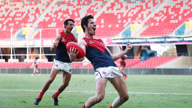 Surfers Paradise players celebrate their QAFL grand final win over Palm Beach Currumbin. Picture: Jason O'Brien