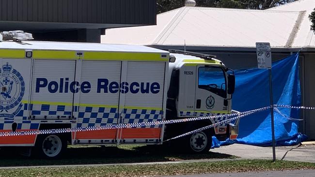 The scene was concealed by a blue tarp, shielding onlookers. Picture: Sarah Buckley