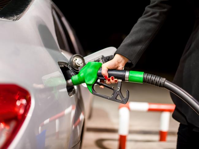 Generic photo - Petrol pump. woman pumping petrol in car at petrol station. Picture: iStock