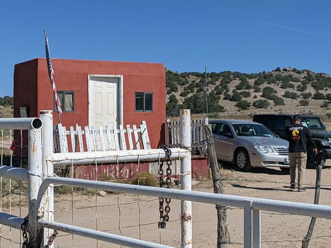 Security guards stand at the entrance of Bonanza Creek Ranch in Santa Fe, New Mexico, on the set of Rust. Picture: AFP