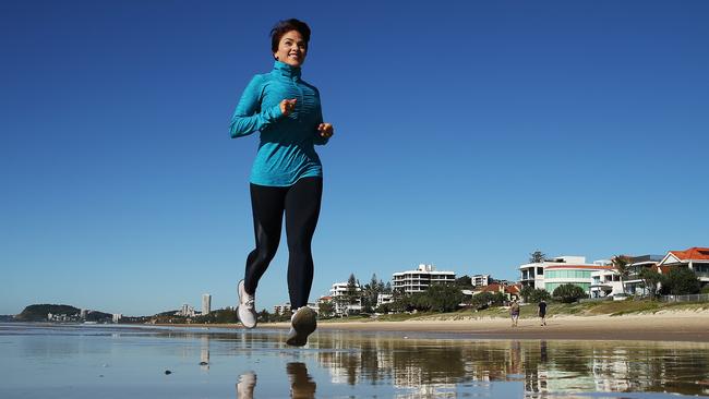 Gabriela Villavicencio training on the beach to run the Gold Coast Marathon. Picture Glenn Hampson