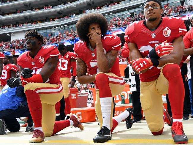 Players with the San Francisco 49ers kneel on the sideline when the anthem is played. Picture: Thearon W. Henderson/Getty Images