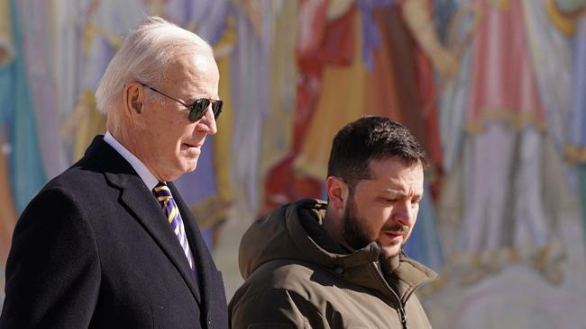 US President Joe Biden walks with Ukrainian President Volodymyr Zelensky <br/>in Kyiv in February last year. Picture: AFP