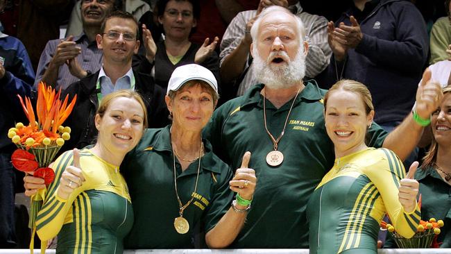 Anna and Kerrie Meares celebrate victory with mum Marilyn and dad Anthony at the Melbourne Commonwealth Games in 2006.