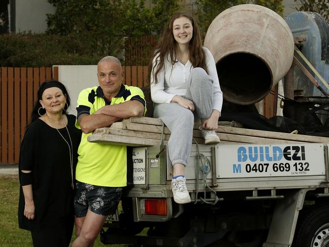 Ross Parillo (centre) with his partner Rosie and daughter Ellie -17.   Ross is a brickie who would consider moving to Qld for work. He is one of the rising number of tradies ready to pack up and move just when we need construction staff more than ever. Picture: John Appleyard