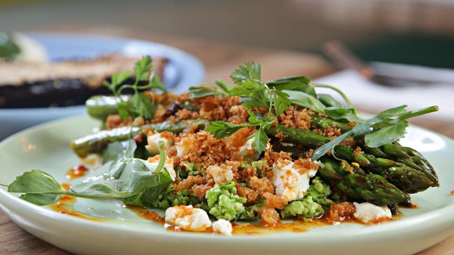 Asparagus, crushed peas, chilli dressing with pangrattato. Pictures: Adam Yip.