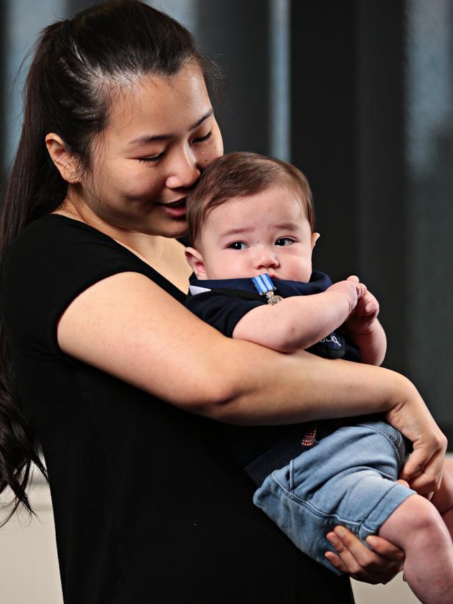 Const Proctor's widow Dianne with the couple’s son Dexter. Picture: Adam Yip