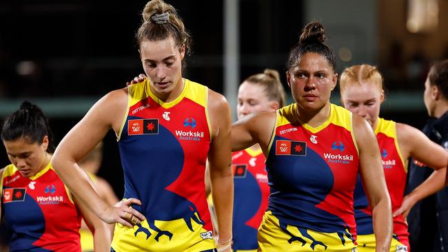 Caitlin Gould (left) and Stevie-Lee Thompson of the Crows after the defeat. Photo by Michael Willson/AFL Photos via Getty Images.