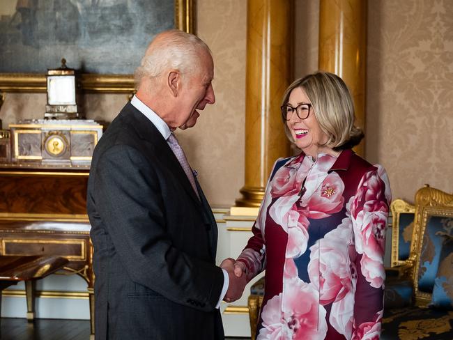 The King was in a jovial mood as he met Joan Marie Aylward during an audience at Buckingham Palace. Picture: Getty Images