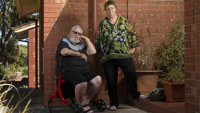 Jan and Robert out the front of their units in Morphett Vale where their mobility scooters were stolen on Saturday. Picture: Emma Brasier.